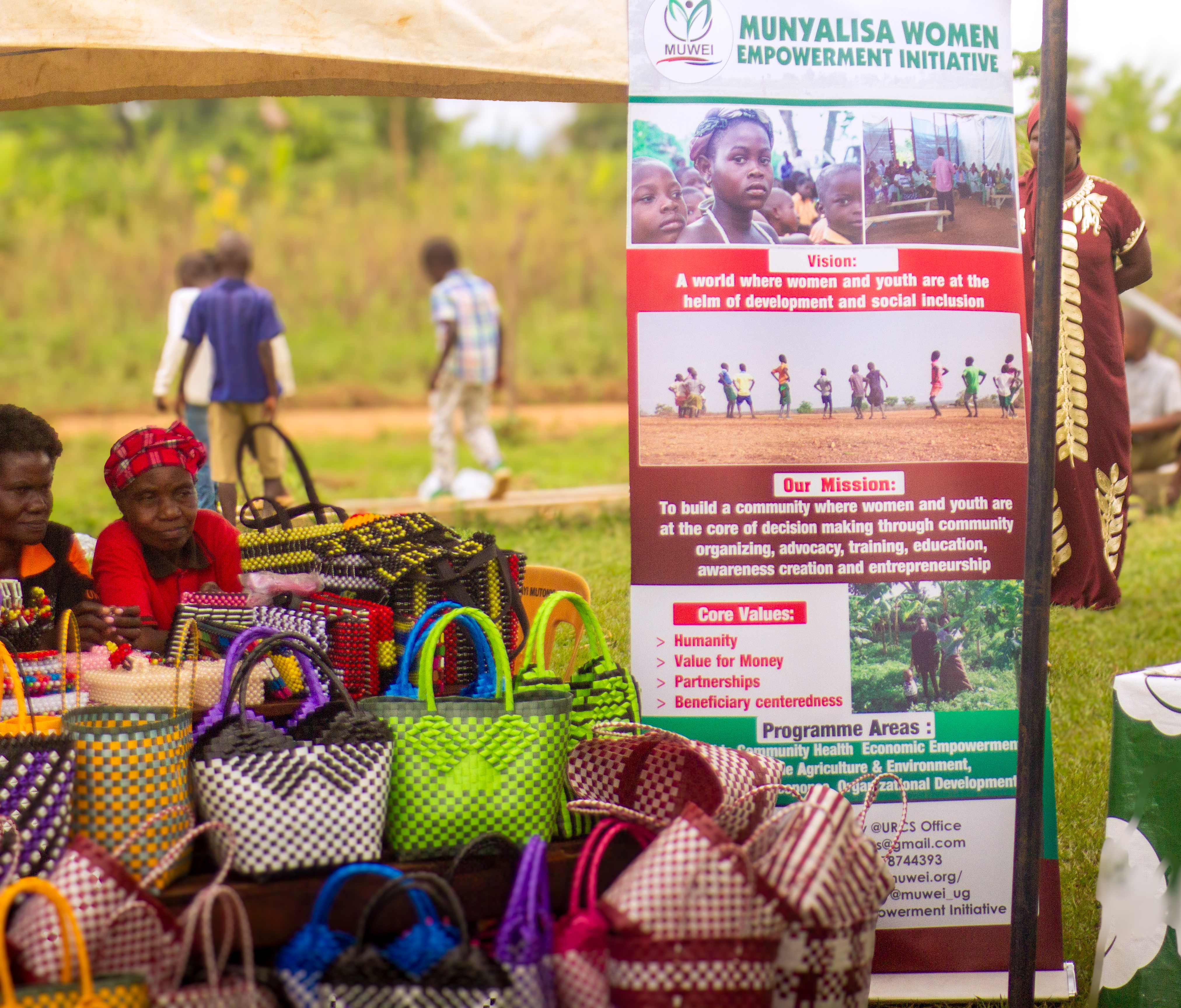 MUWEI staff and community members working together in a project